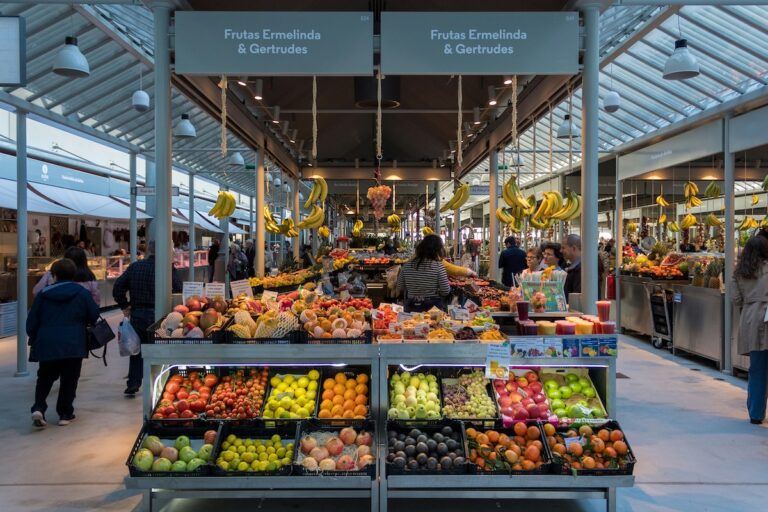 Fresh vegetables displayed in a grocery store, helping save money on groceries while eating healthy