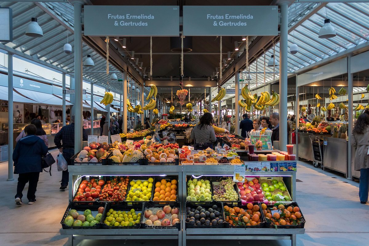 Fresh vegetables displayed in a grocery store, helping save money on groceries while eating healthy